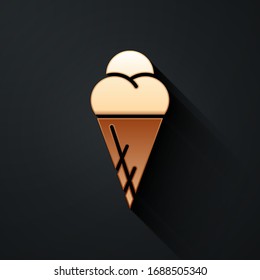 Gold Ice cream in waffle cone icon isolated on black background. Sweet symbol. Long shadow style. Vector Illustration