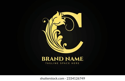 gold initial letter C logo design with beautiful and elegant flower and feather decoration.