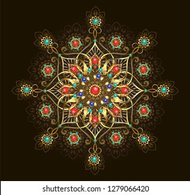 Gold jewelry mandala, decorated with turquoise, jasper and lapis lazuli on dark brown background.