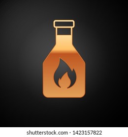 Gold Ketchup bottle icon isolated on black background. Vector Illustration