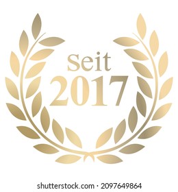 Gold Laurel wreath with German text since 2017 isolated on a white background 