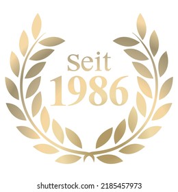 Gold Laurel wreath with German text since 1986 isolated on a white background