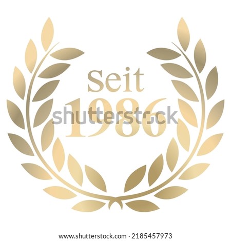 Gold Laurel wreath with German text since 1986 isolated on a white background