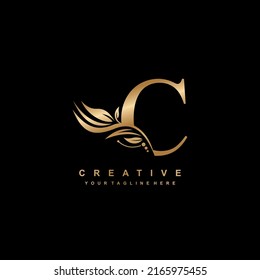 gold letter C logo design with luxurious and beautiful leaf ornament. C Monogram. C typography. gold feather logo. initial letter C logo - Shutterstock ID 2165975455