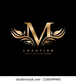gold letter M logo design with luxurious and beautiful leaf ornament. M Monogram. M typography. gold feather logo. initial letter M logo