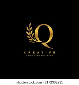 gold letter Q logo design with luxurious and beautiful leaf ornament. Q Monogram. Q typography. gold feather logo. initial letter Q logo. golden flower logo. Suitable for boutique, wedding, hotel, etc