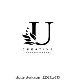 gold letter U logo design with flourish ornaments. logo U with floral and leaf ornaments. U beautiful logo. luxury letter U logo design