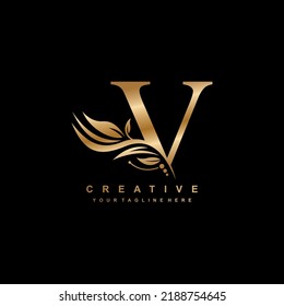 gold letter V logo design with luxurious and beautiful leaf ornament. V Monogram. V typography. gold feather logo. initial letter V logo