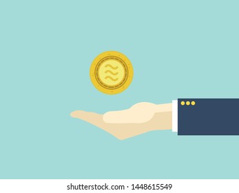 Gold libra coin in hand businessman,business success concept