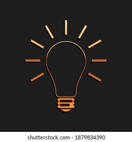 Gold Light bulb with rays shine icon isolated on black background. Energy and idea symbol. Lamp electric. Long shadow style. Vector.