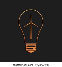 Gold Light bulb with wind turbine as idea of eco friendly source of energy icon isolated on black background. Alternative energy concept. Long shadow style. Vector