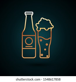 Gold line Beer bottle and glass icon isolated on dark blue background. Alcohol Drink symbol.  Vector Illustration
