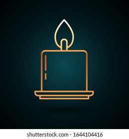 Gold line Burning candle in candlestick icon isolated on dark blue background. Cylindrical candle stick with burning flame.  Vector Illustration