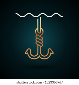 Gold line Fishing hook under water icon isolated on dark blue background. Fishing tackle.  Vector Illustration