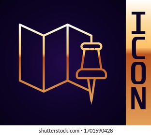 Gold line Folded map with push pin icon isolated on black background.  Vector Illustration