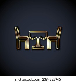 Gold line French cafe icon isolated on black background. Street cafe. Table and chairs.  Vector