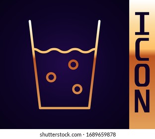 Gold line Glass with water icon isolated on black background. Soda glass.  Vector Illustration