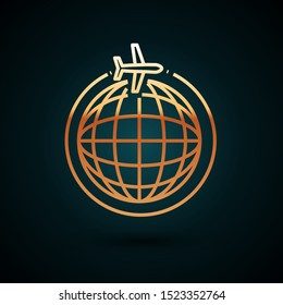 Gold line Globe with flying plane icon isolated on dark blue background. Airplane fly around the planet earth. Aircraft world icon.  Vector Illustration