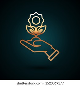 Gold line Hand holding flower icon isolated on dark blue background. Seed and seedling. Planting sapling. Ecology concept.  Vector Illustration