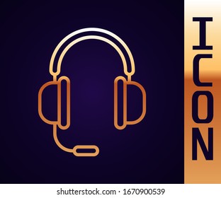 Gold line Headphones with microphone icon isolated on black background.  Vector Illustration
