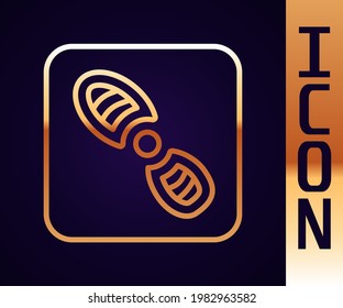 Gold line Human footprints shoes icon isolated on black background. Shoes sole.  Vector