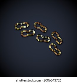 Gold line Human footprints shoes icon isolated on black background. Shoes sole.  Vector