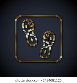 Gold line Human footprints shoes icon isolated on black background. Shoes sole.  Vector