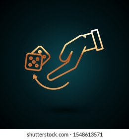 Gold line Human hand throwing game dice icon isolated on dark blue background.  Vector Illustration