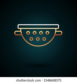 Gold line Kitchen colander icon isolated on dark blue background. Cooking utensil. Cutlery sign.  Vector Illustration