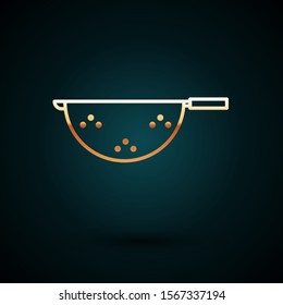 Gold line Kitchen colander icon isolated on dark blue background. Cooking utensil. Cutlery sign.  Vector Illustration