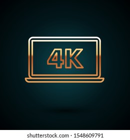 Gold line Laptop screen with 4k video technology icon isolated on dark blue background.  Vector Illustration