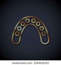 Gold line Mouth guard boxer icon isolated on black background.  Vector