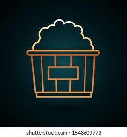 Gold line Popcorn in cardboard box icon isolated on dark blue background. Popcorn bucket box.  Vector Illustration