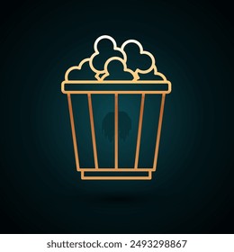 Gold line Popcorn in cardboard box icon isolated on dark blue background. Popcorn bucket box.  Vector