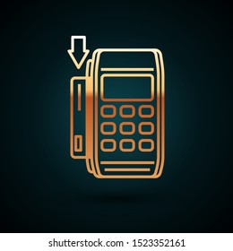 Gold line Pos terminal with inserted credit card icon isolated on dark blue background. Payment terminal transaction. Pay by card.  Vector Illustration