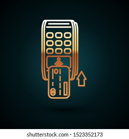 Gold line Pos terminal with inserted credit card icon isolated on dark blue background. Payment terminal transaction. Pay by card.  Vector Illustration