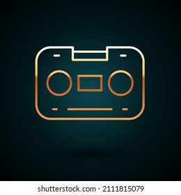 Gold line Retro audio cassette tape icon isolated on dark blue background.  Vector