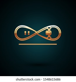 Gold line Skateboard trick icon isolated on dark blue background. Extreme sport. Sport equipment.  Vector Illustration