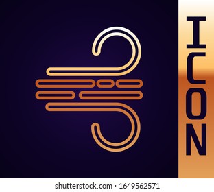 Icono de la línea dorada del viento aislado en fondo negro. Tiempo ventoso.  Ilustración vectorial