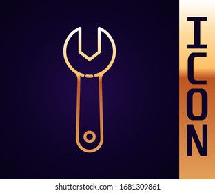 Gold line Wrench spanner icon isolated on black background.  Vector Illustration