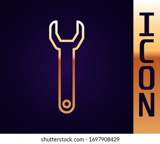 Gold line Wrench spanner icon isolated on black background.  Vector Illustration
