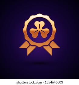 Gold Medal with four leaf clover icon isolated on dark blue background. Happy Saint Patrick day.  Vector Illustration