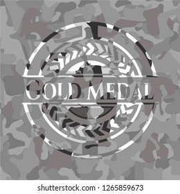 Gold Medal on grey camouflage texture