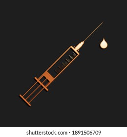 Gold Medical syringe with needle and drop icon isolated on black background. Syringe sign for vaccine, vaccination, injection, flu shot. Long shadow style. Vector.