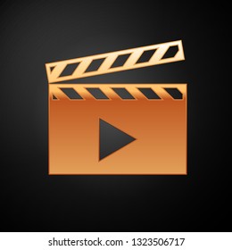 Gold Movie clapper icon isolated on black background. Film clapper board icon. Clapperboard sign. Cinema production or media industry concept. Vector Illustration