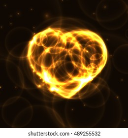Gold neon plasma bubbles heart on dark background. Yellow laser heart made from circles on dark background. Fire Heart from rings in the dark