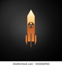 Gold Nuclear rocket icon isolated on black background. Rocket bomb flies down.  Vector Illustration