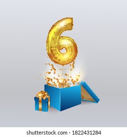 Gold number six 6 a metal ball flies out of the box with a serpentine and a gift. Party decoration with Golden balloons. Anniversary sign for a happy holiday, celebration, birthday, carnival.