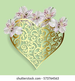 Gold openwork heart and flowers on green background