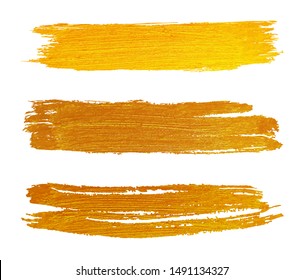 Gold paint brush strokes set